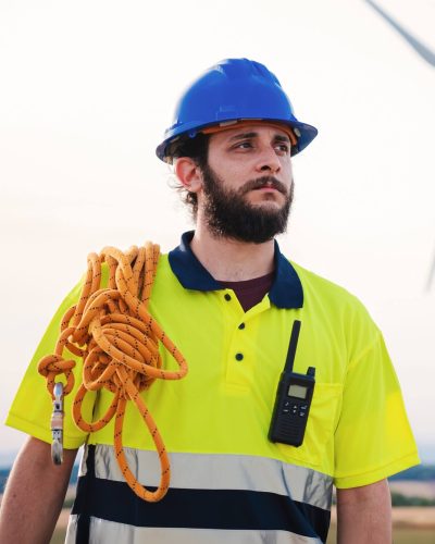 vertical-bearded-technician-engineer-of-windmill-and-renewable-energy-industry-working-and-looking.jpg